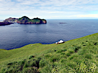 on the top : view to the Bjarnarey-Lodge and to Heimaey